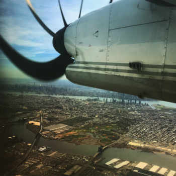 New York - Propeller plane  above NY