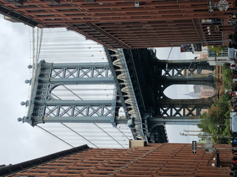 New York - The Empire state building being protected by the Manhattan bridge