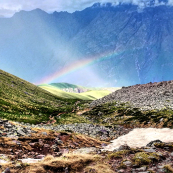 Georgia - Rainbow in the valley around Kazbegi mountains