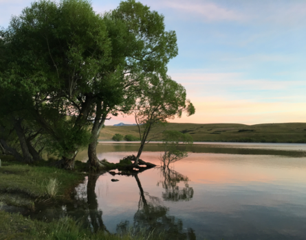 New York - Zonsopgang aan een meer in New Zealand